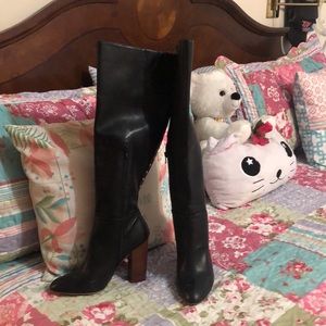 Black tall boots ,studs up the back